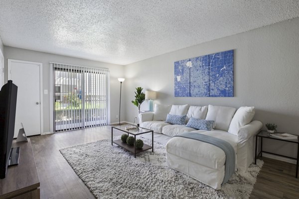 Spacious living room with modern decor at Woodland Trails Apartments