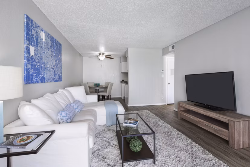 Cozy living room with modern furniture at Woodland Trails Apartments