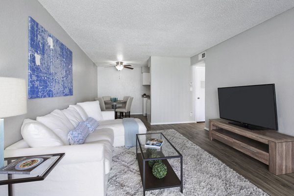 Cozy living room with modern furniture at Woodland Trails Apartments