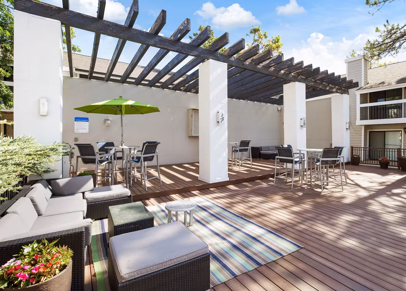 Outdoor grill area with modern stainless steel equipment at Woodland Trails luxury apartments