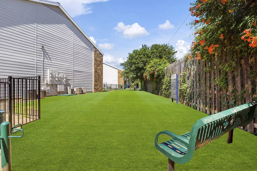 Dog park featuring agility equipment at Woodland Trails Apartments