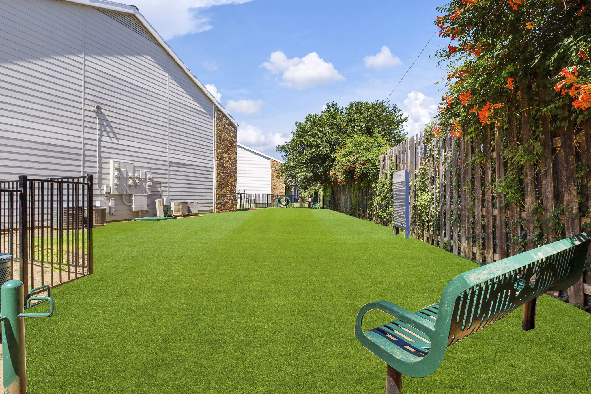 Dog park featuring agility equipment at Woodland Trails Apartments