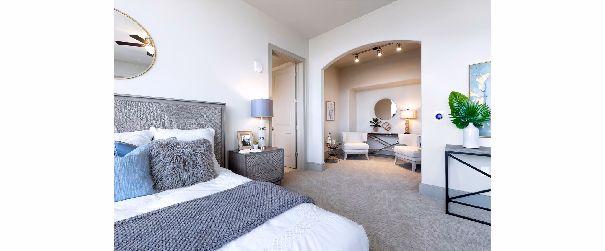 Modern bedroom with elegant furnishings at Ashton Austin Apartments