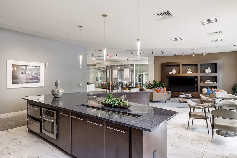 Spacious clubhouse with modern decor at Ashton Austin Apartments, ideal for social gatherings and events
