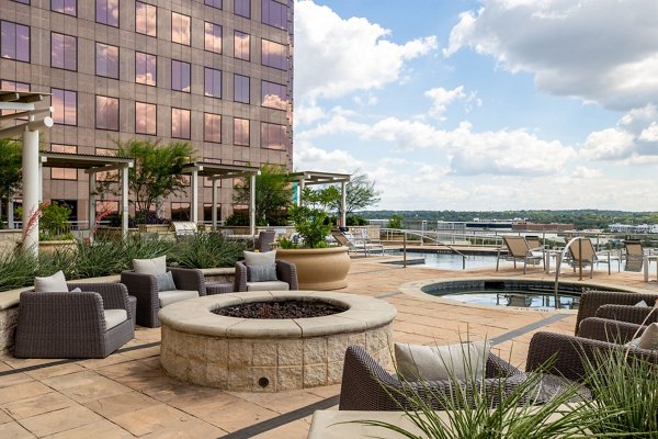 Modern clubhouse with seating and billiards at Ashton Austin Apartments