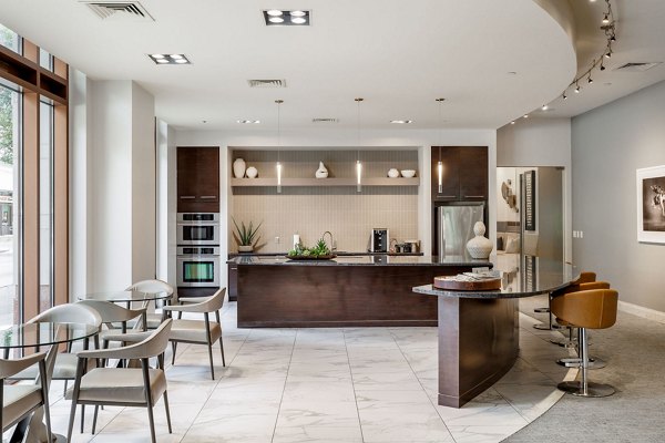 Clubhouse featuring modern decor and spacious seating at Ashton Austin Apartments