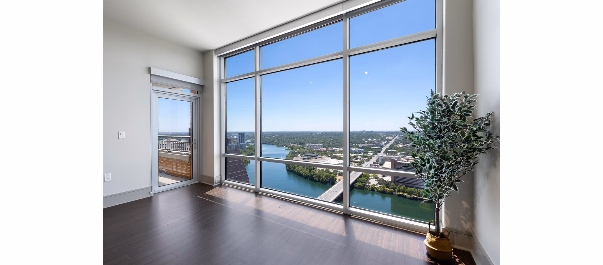 Spacious outdoor patio at Ashton Austin Apartments with modern seating and scenic city views