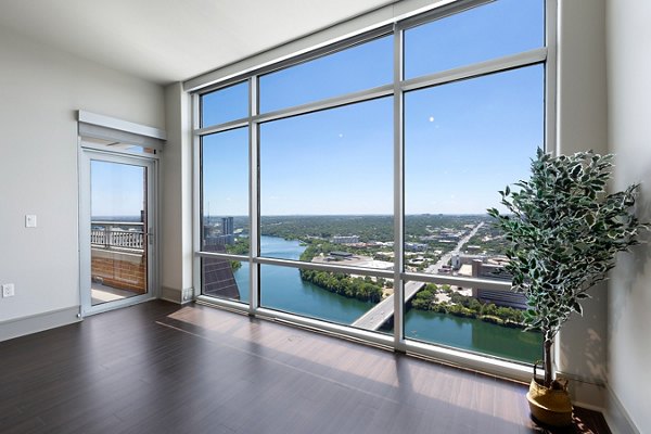 Spacious outdoor patio at Ashton Austin Apartments with modern seating and scenic city views