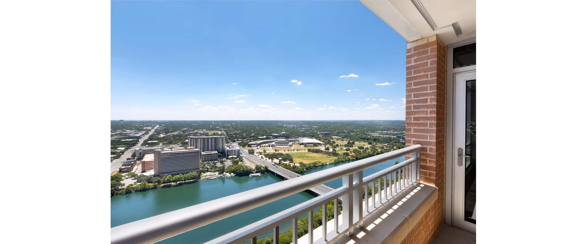 Patio with modern seating and greenery at Ashton Austin Apartments