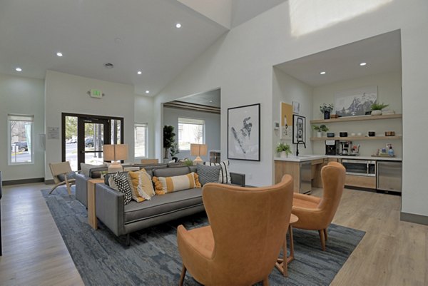 Clubhouse with modern design and comfortable seating at Greenwood Point Apartments