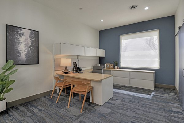 Clubhouse featuring modern design and cozy seating at Greenwood Point Apartments