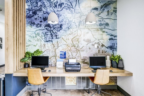 Clubhouse lobby with modern decor and seating area at Greenwood Point Apartments