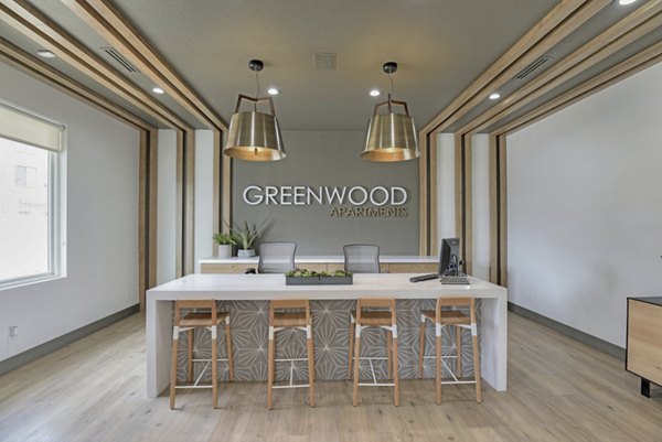 Clubhouse featuring modern design and seating at Greenwood Point Apartments