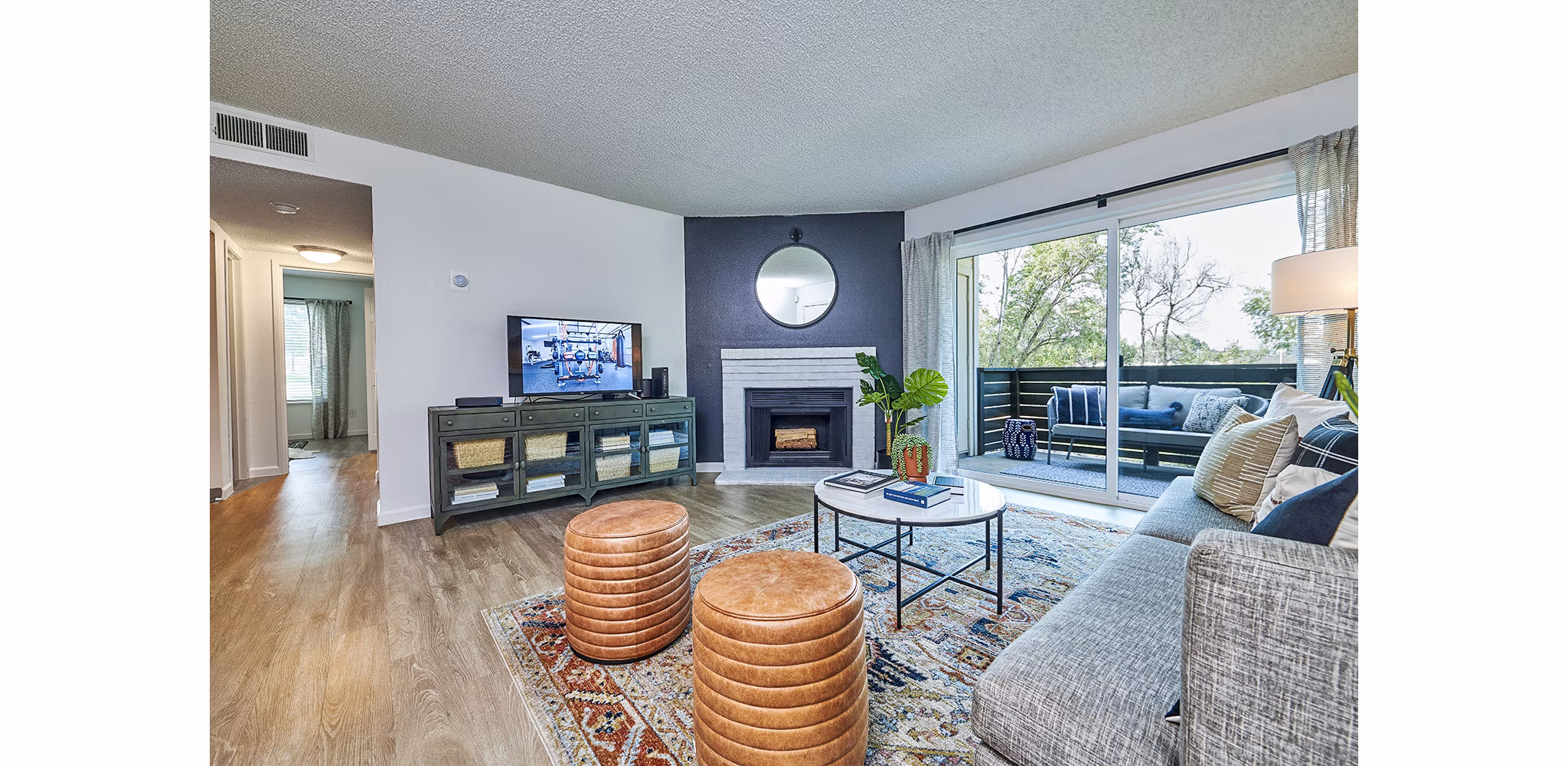 Living room featuring modern design and cozy seating in Greenwood Point Apartments