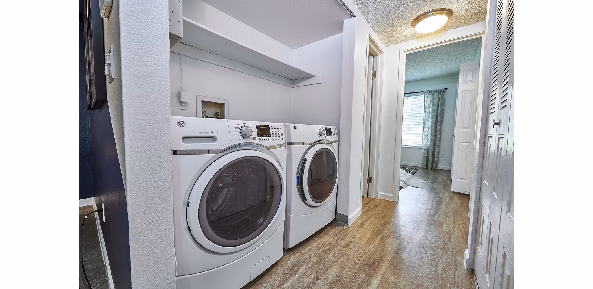 Laundry facilities at Greystar's Greenwood Point Apartments featuring modern washers and dryers