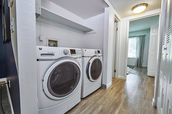 Laundry facilities at Greystar's Greenwood Point Apartments featuring modern washers and dryers