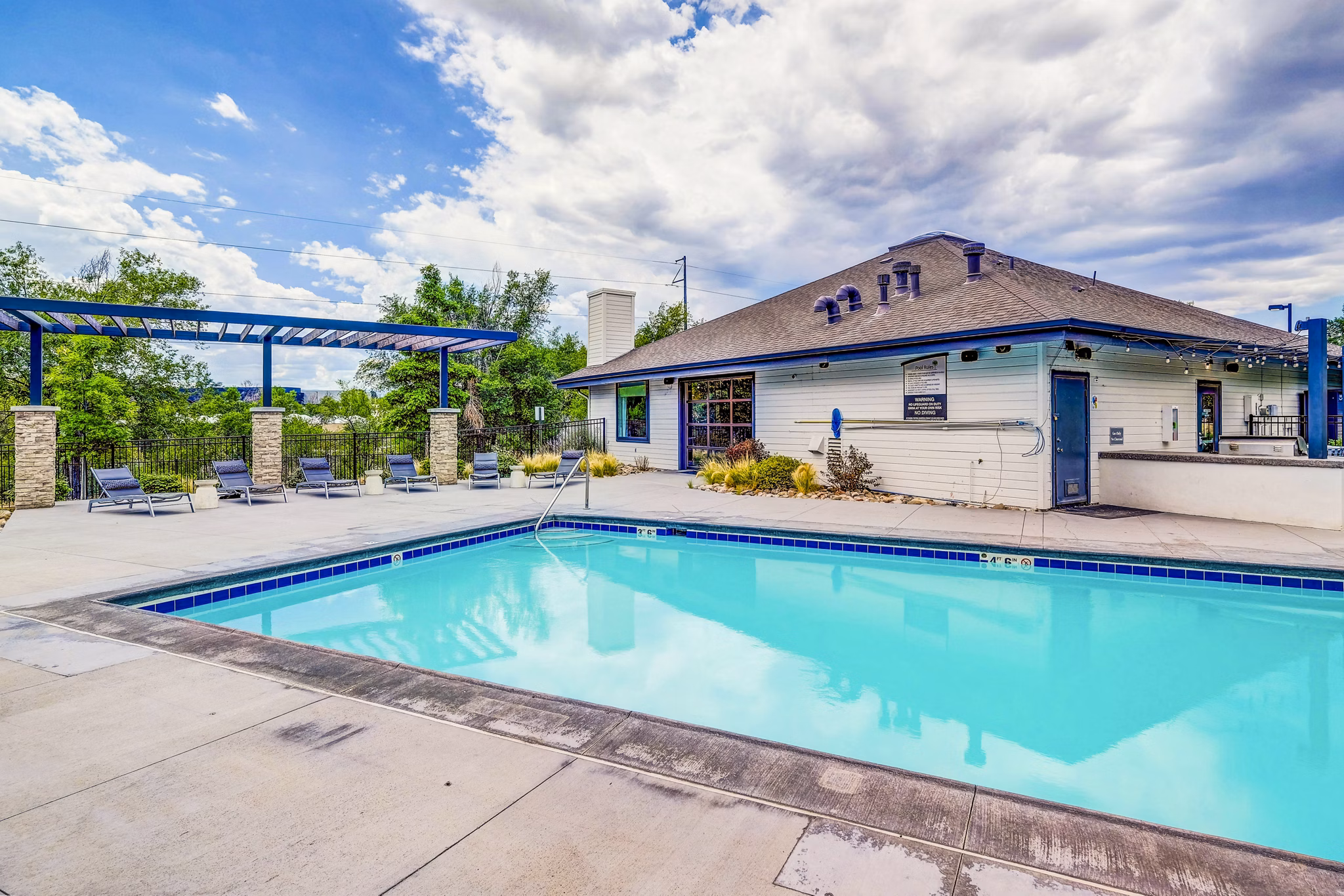 Resort-style pool with sundeck at Greenwood Point Apartments
