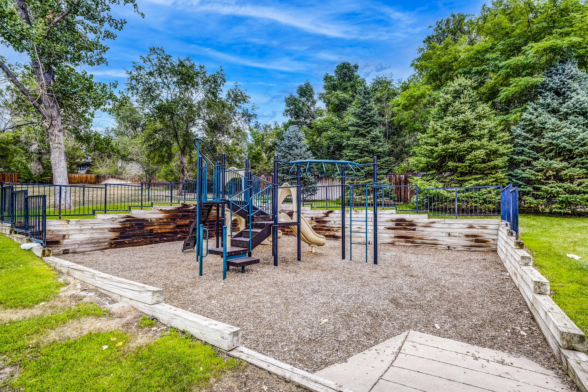 Modern playground for families at Greenwood Point Apartments, featuring safe play equipment in a welcoming community setting