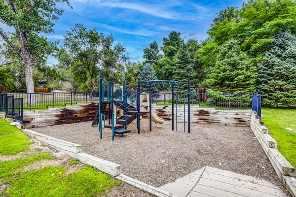 Modern playground for families at Greenwood Point Apartments, featuring safe play equipment in a welcoming community setting