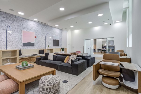 Elegant clubhouse with modern decor at Landmark Apartments, a luxury community offering social and recreational spaces