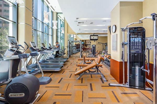 Modern fitness center with state-of-the-art equipment at The Olivian Apartments