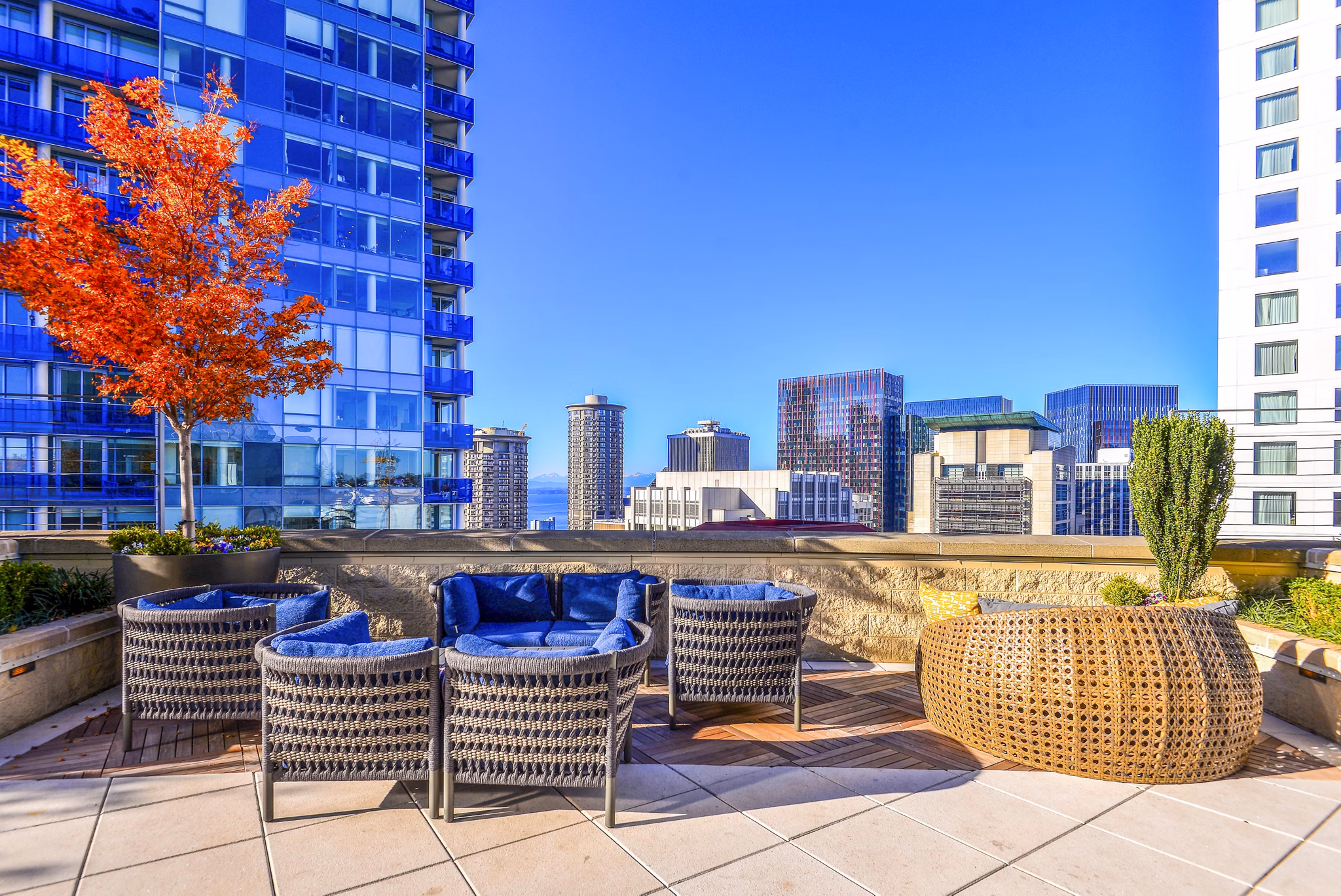 Patio at The Olivian: Luxury outdoor space with modern seating and city views in a Seattle apartment community