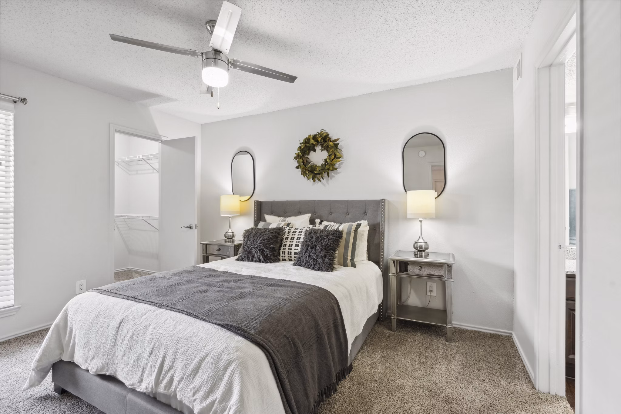 Bedroom featuring elegant furnishings and a large window in Townlake of Coppell Apartments