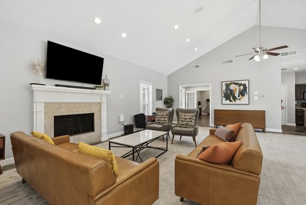 Bright, open living room with modern furniture at Townlake of Coppell Apartments