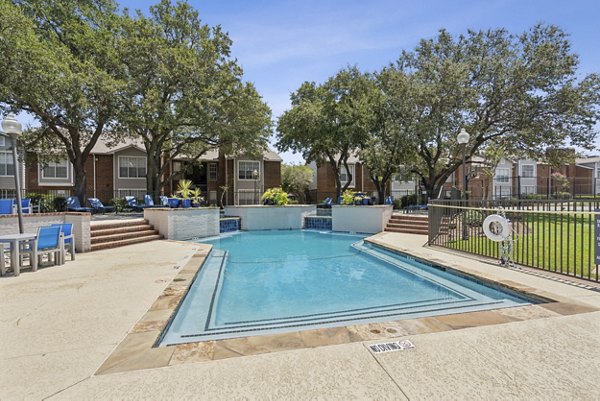 Resort-style pool with sun loungers at Townlake of Coppell Apartments, a Greystar luxury community