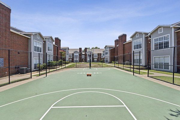 Outdoor sport court at Townlake of Coppell Apartments ideal for basketball and tennis activities