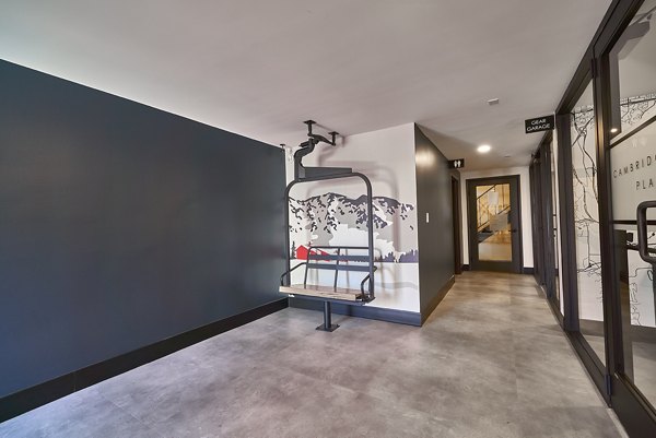 Indoor hallway featuring a decorative ski lift chair accent at luxury apartments