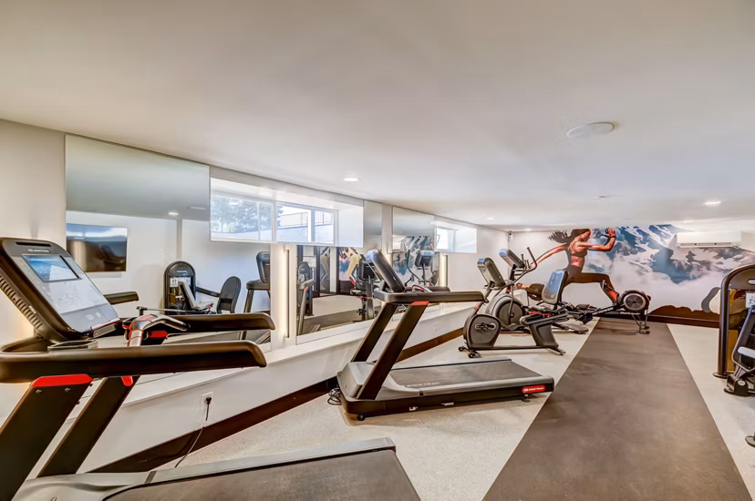 Modern fitness center with state-of-the-art equipment in luxury apartments