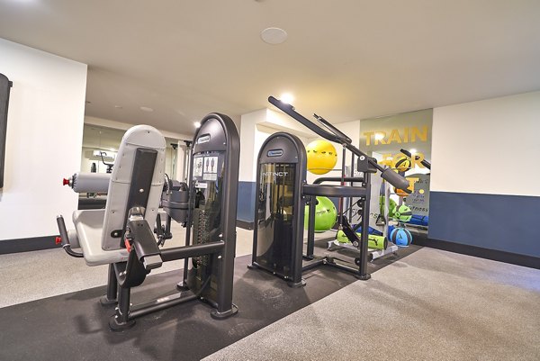 Modern fitness center with state-of-the-art equipment in luxury apartments