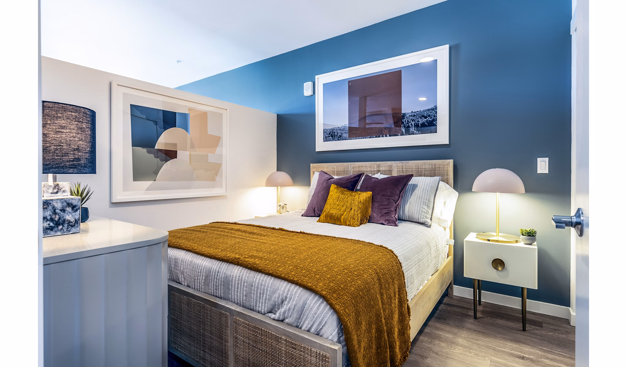 Cozy bedroom with modern decor and natural light in Jackson Apartments