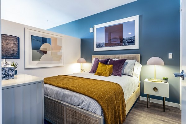 Cozy bedroom with modern decor and natural light in Jackson Apartments