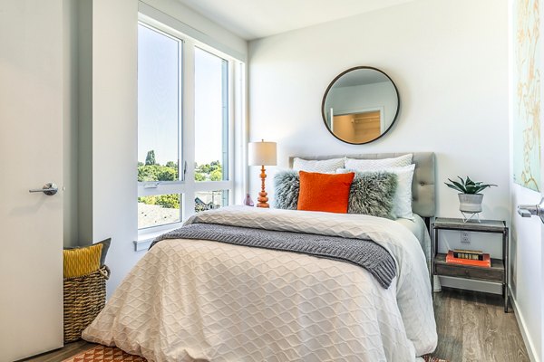 Cozy bedroom with elegant decor at Jackson Apartments