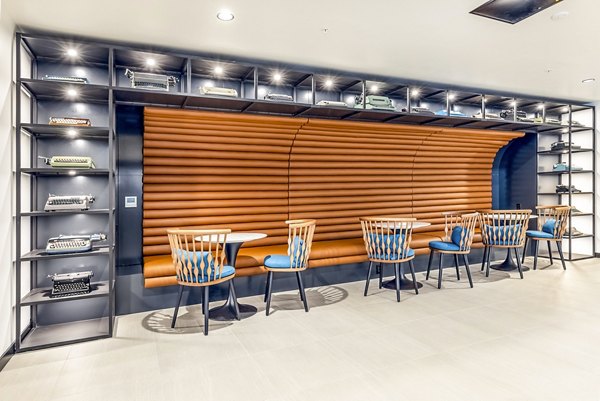Modern clubhouse with stylish seating and fireplace at Jackson Apartments, offering luxury living and community events