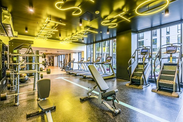 Modern fitness center at Jackson Apartments featuring state-of-the-art equipment and spacious workout areas