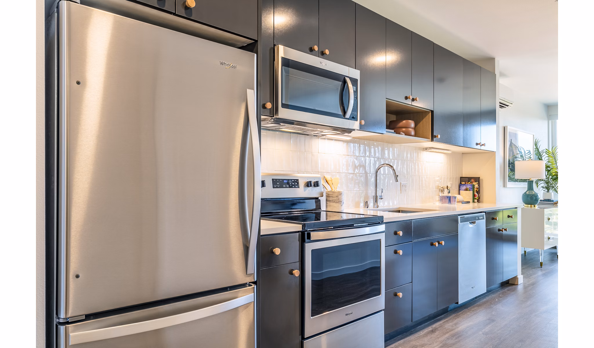 Modern kitchen featuring stainless steel appliances at Jackson Apartments, perfect for culinary enthusiasts in a luxury setting