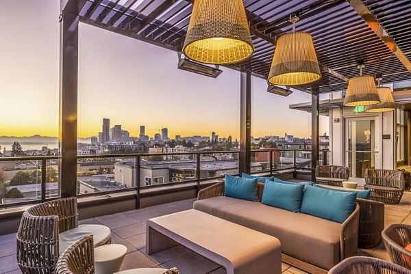 Scenic patio balcony at Jackson Apartments featuring modern outdoor seating with city skyline views