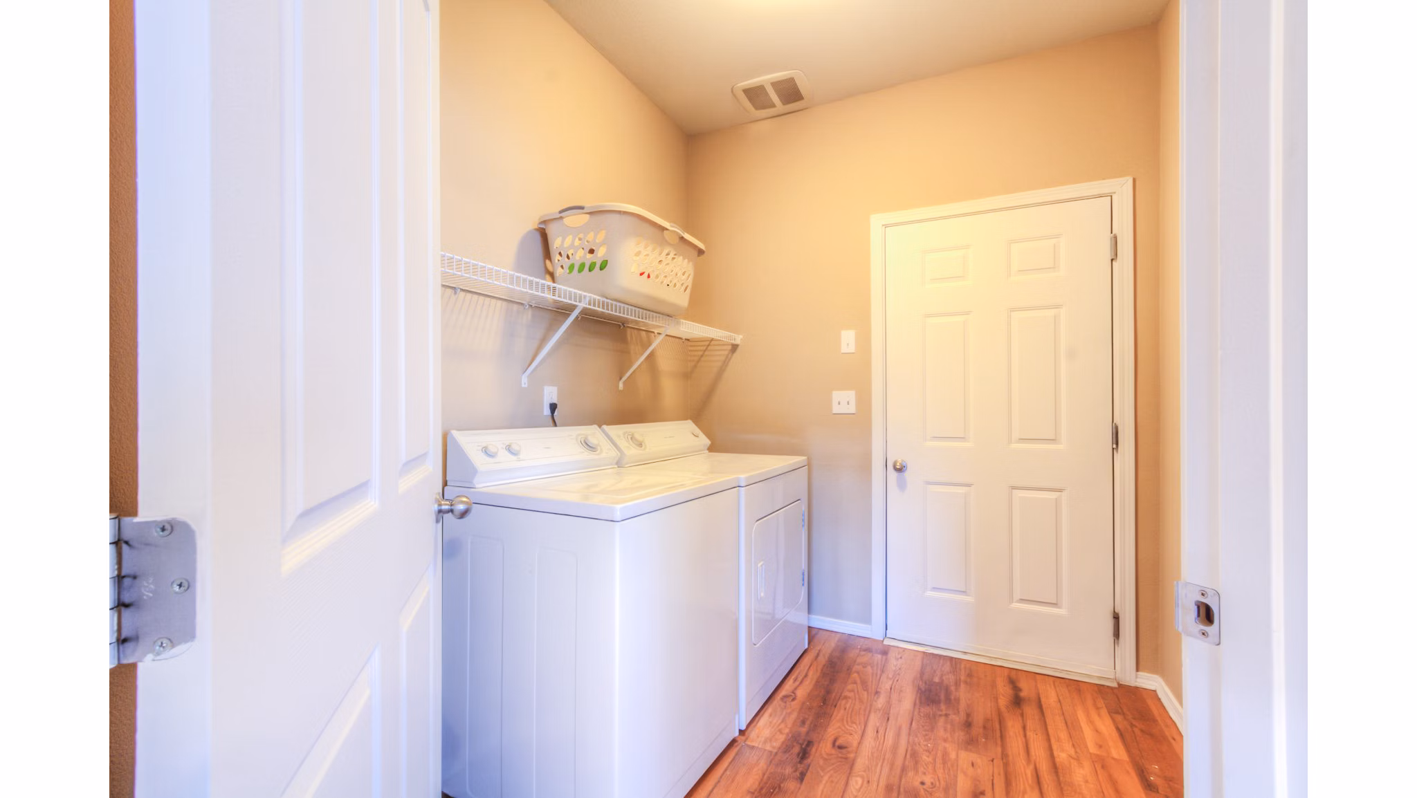 Laundry room featuring modern washer and dryer at Bradley Park Apartments