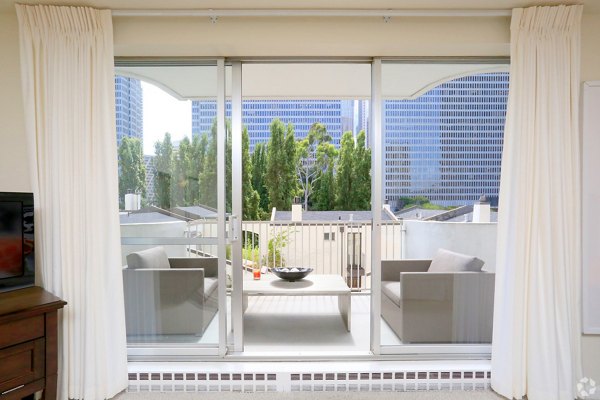 Chic patio with outdoor seating at The Gateway Apartments offering residents a relaxing environment in this luxury property