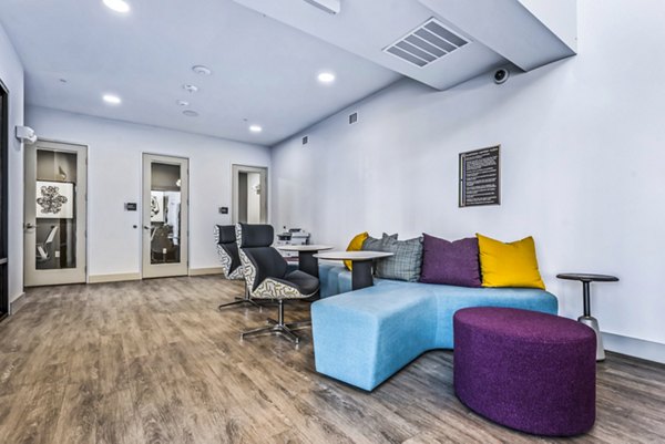 Modern clubhouse with sleek design at Rhythm Apartments, offering luxury amenities and social spaces