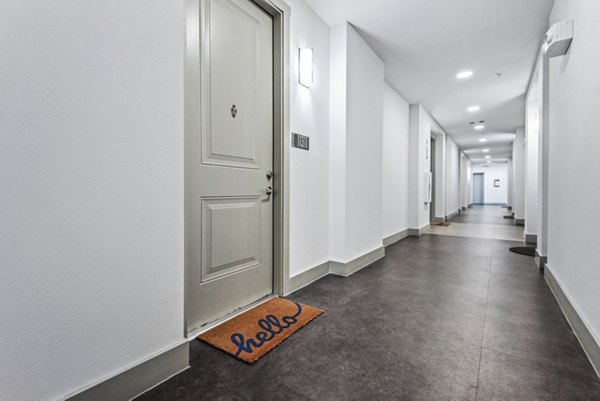 hallway to residences at Rhythm Apartments