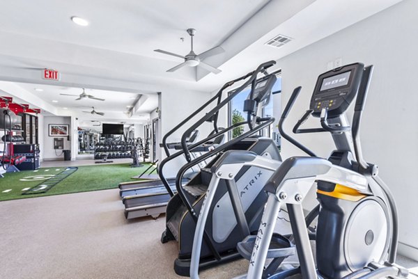 State-of-the-art fitness center with modern equipment at Rhythm Apartments