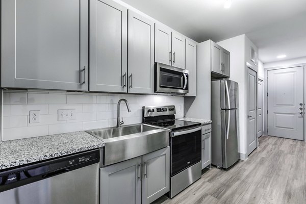 Modern kitchen with stainless steel appliances at Rhythm Apartments, Greystar luxury community