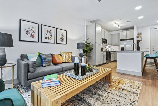 Modern living room with sleek furnishings in Rhythm Apartments, offering luxury apartments by Greystar