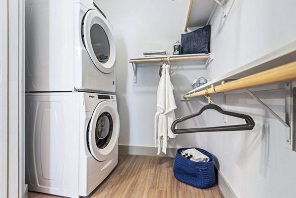 Walk-in closet with laundry facilities at Rhythm Apartments