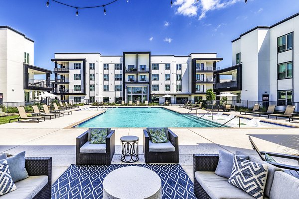 Relaxing pool and patio area at Rhythm Apartments, a Greystar luxury community