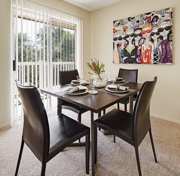 Dining area featuring modern furnishings and pendant lighting in Copper Ridge Apartments